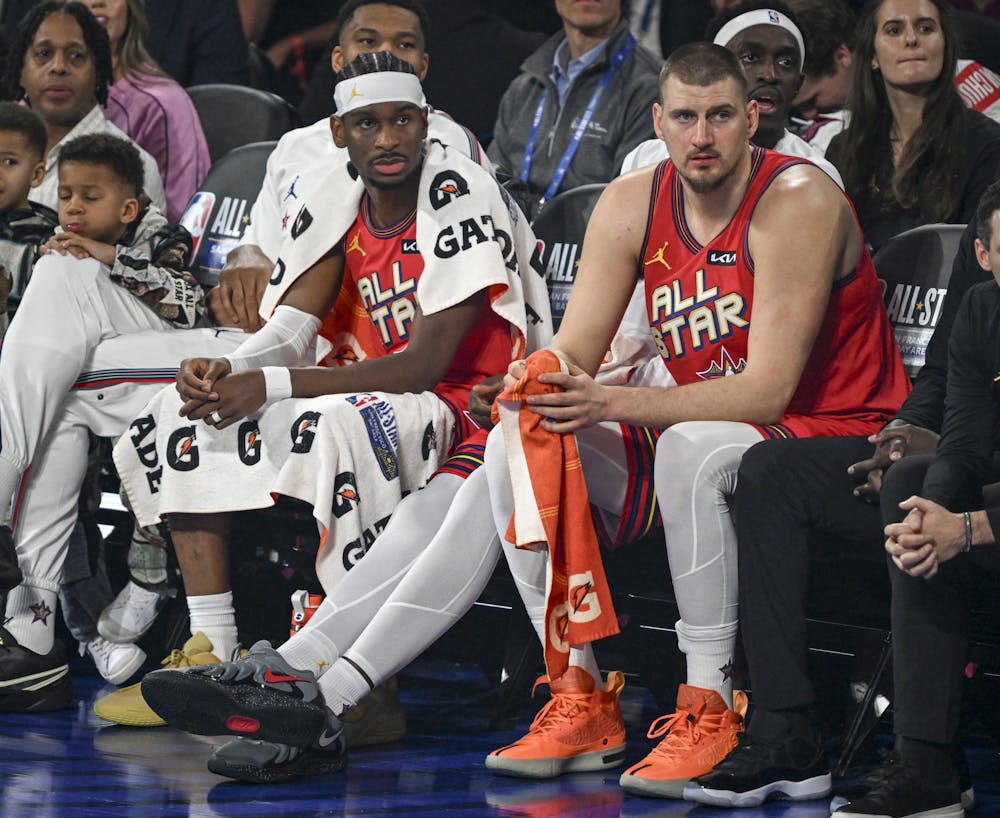 Shai Gilgeous-Alexander (2) of the Oklahoma City Thunder and Nikola Jokic (15) of the Denver Nuggets sit on the bench during the NBA All-Star Game at Chase Center in San Francisco, California on Sunday, Feb. 16, 2025. (Photo by AAron Ontiveroz/The Denver Post)