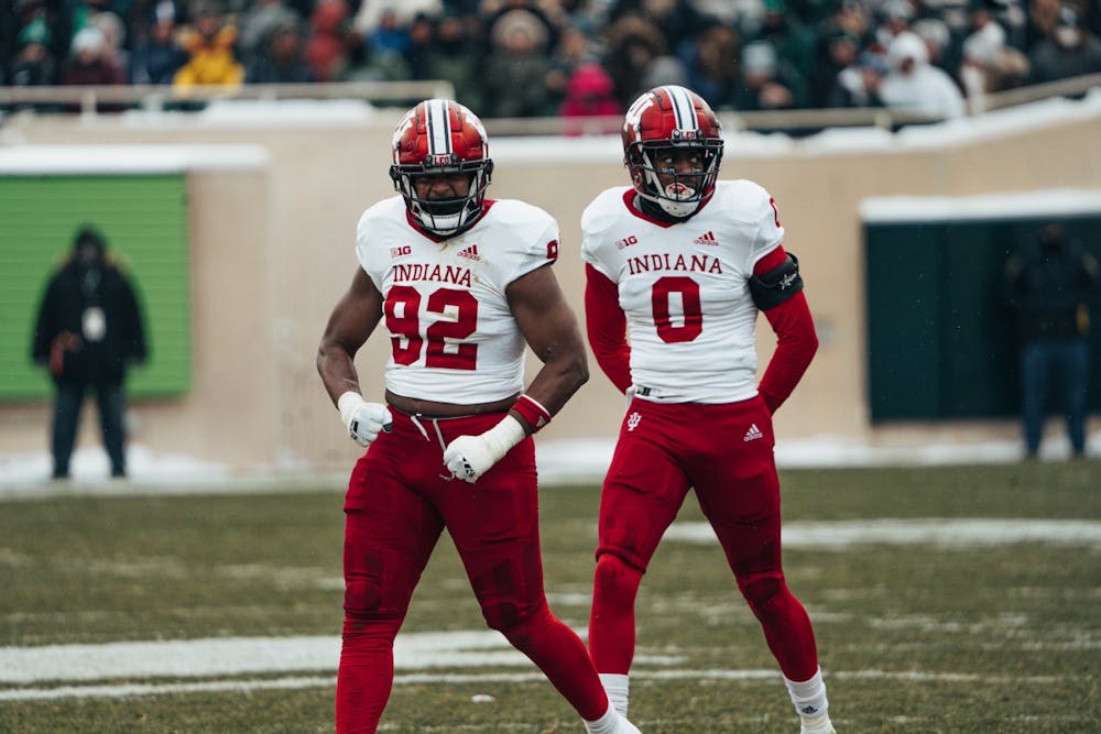 Indiana defensive linemen Alfred Bryant (left) and Dasan McCullough celebrate during IU's double-overtime win against Michigan State on Nov. 19. (HN photo/Max Wood)