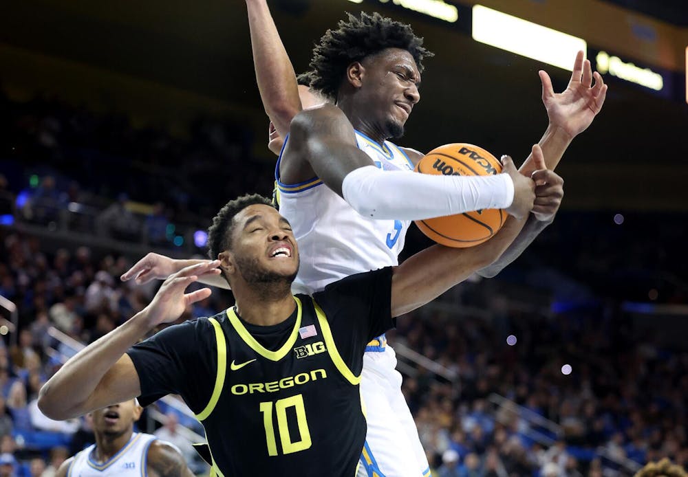 Los Angeles, California January 30, 2025-UCLA's Eric Dailey Jr. grabs a rebound from Oregon's Kwame Evans Jr. in the first half at Pauley Pavilion Thursday. (Wally Skalij/Los Angeles Times/Tribune Content Agency)