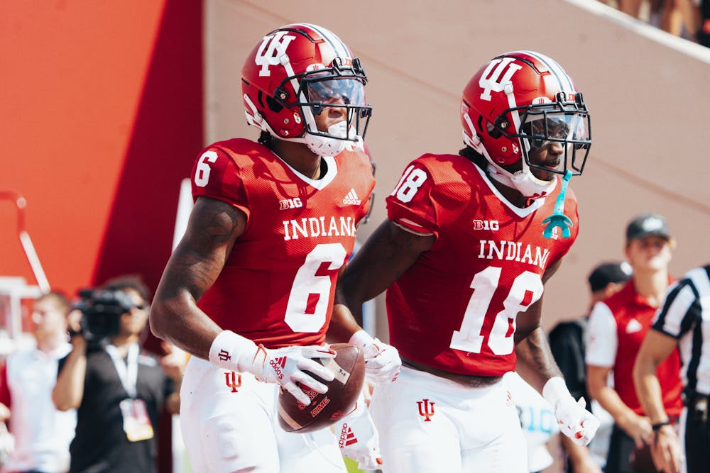 Indiana receivers Cam Camper and Javon Swinton run alongside each other during Indiana's overtime win over Western Kentucky on Sept. 17. (HN photo/Max Wood)