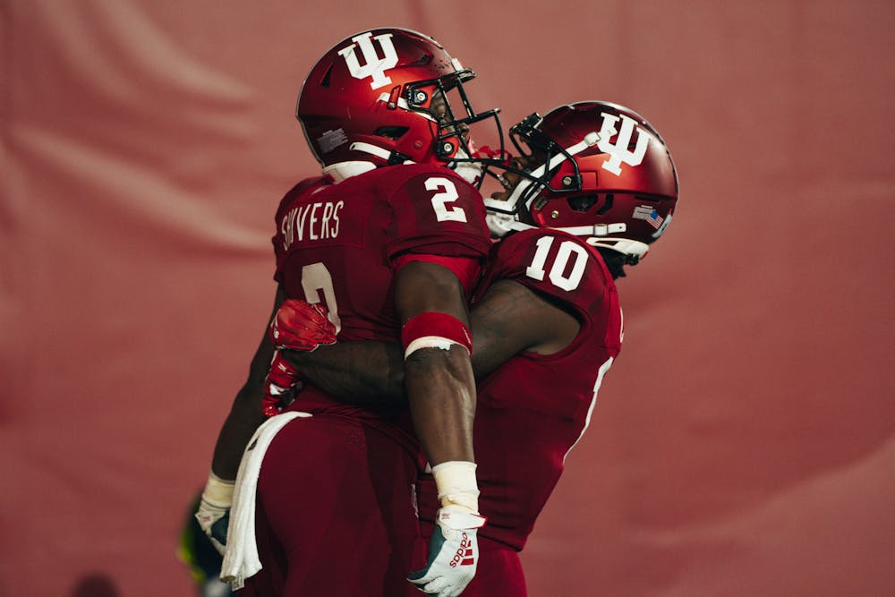 Wide receiver Andison Coby lifts running back Shaun Shivers in celebration during Indiana's win over Idaho on Sept. 10. (HN photo/Max Wood)