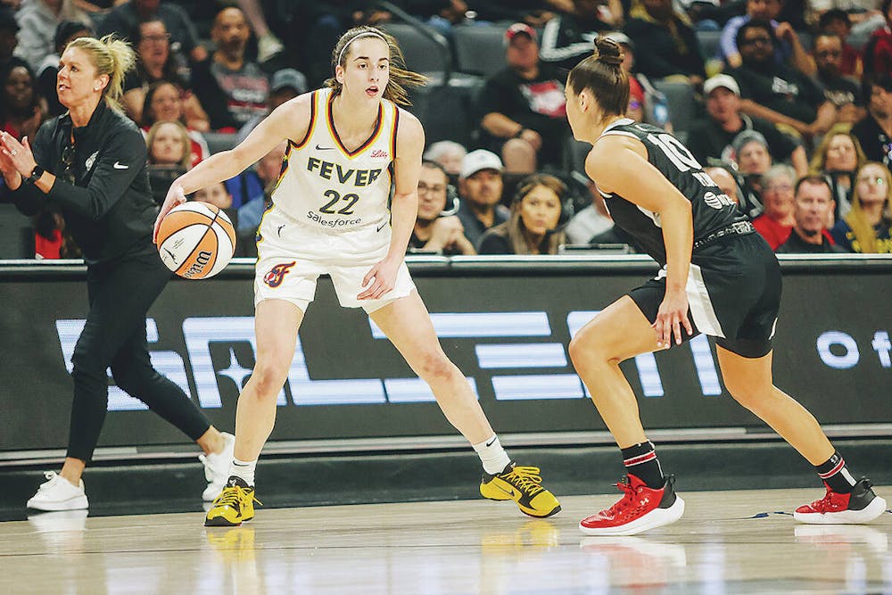 Indiana Fever guard Caitlin Clark (22) dribbles the ball as Aces guard Kelsey Plum (10) guards her during a game between the Aces and Indiana Fever at Michelob Ultra Arena on Saturday, May 25, 2024, in Las Vegas. (Madeline Carter/Las Vegas Review-Journal)