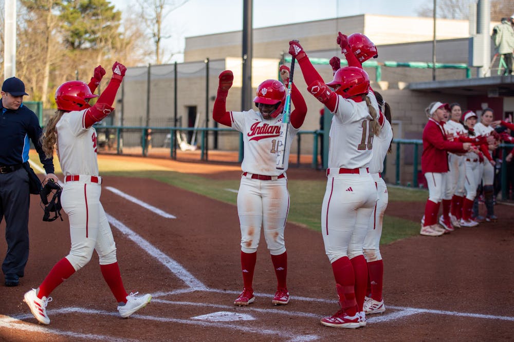 Taylor Minnick (left) celebrates with her teammates after hitting a two-run home run in Indiana's win over Bowling Green on March 7, 2025. (HN photo/Mason Munn)