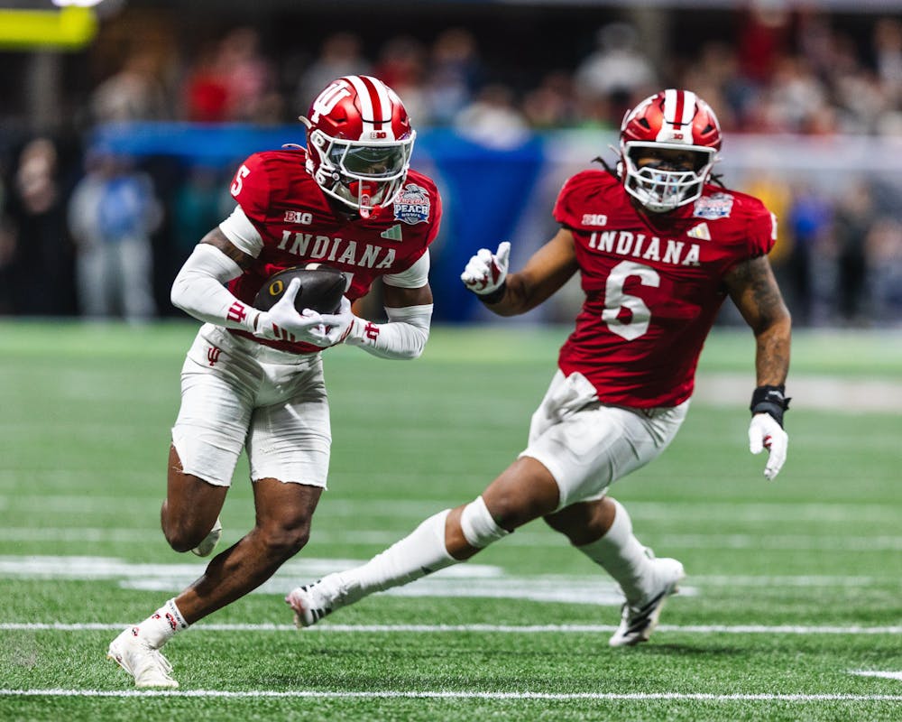 <p>D’Angelo Ponds (5, left) runs back his pick-6 with Mikail Kamara (6, right) in the 56-22 win over No. 5 Oregon in the Peach Bowl on Jan. 9, 2026. (HN photo/Kal Graybill)</p><p></p>