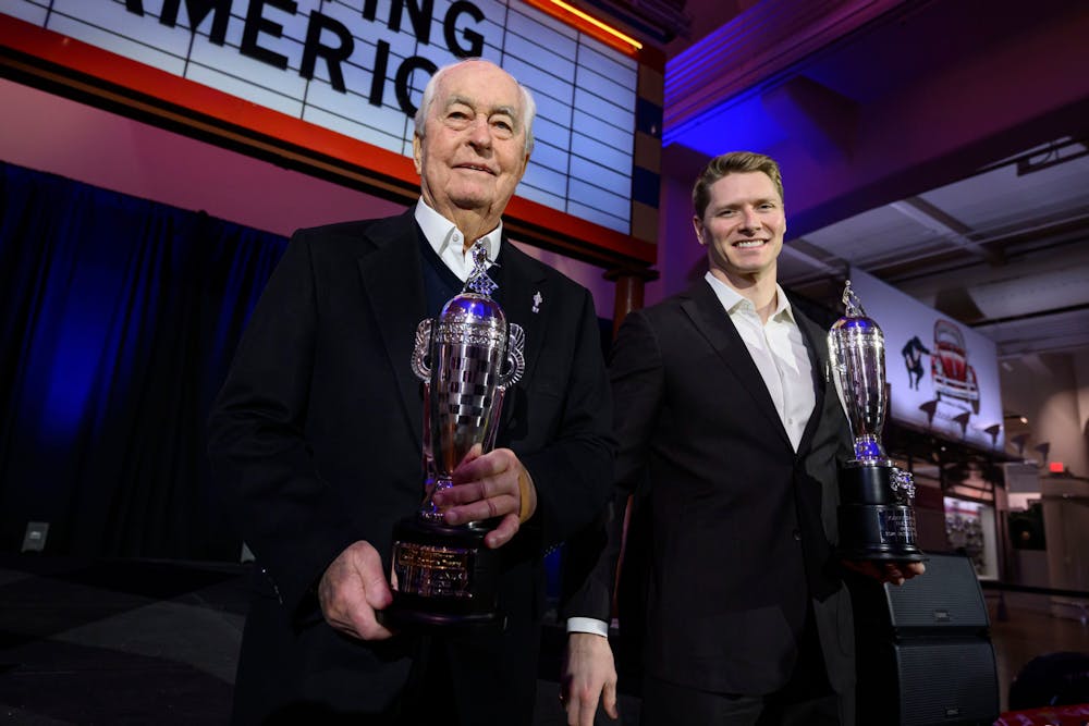 (From left) Roger Penske and Josef Newgarden hold their Baby Borg trophies for the 2024 Indianapolis 500 and the team owner's trophy during a ceremony at the Henry Ford museum, in Dearborn, January 16, 2025. (David Guralnick, Detroit News, Tribune Content Agency)