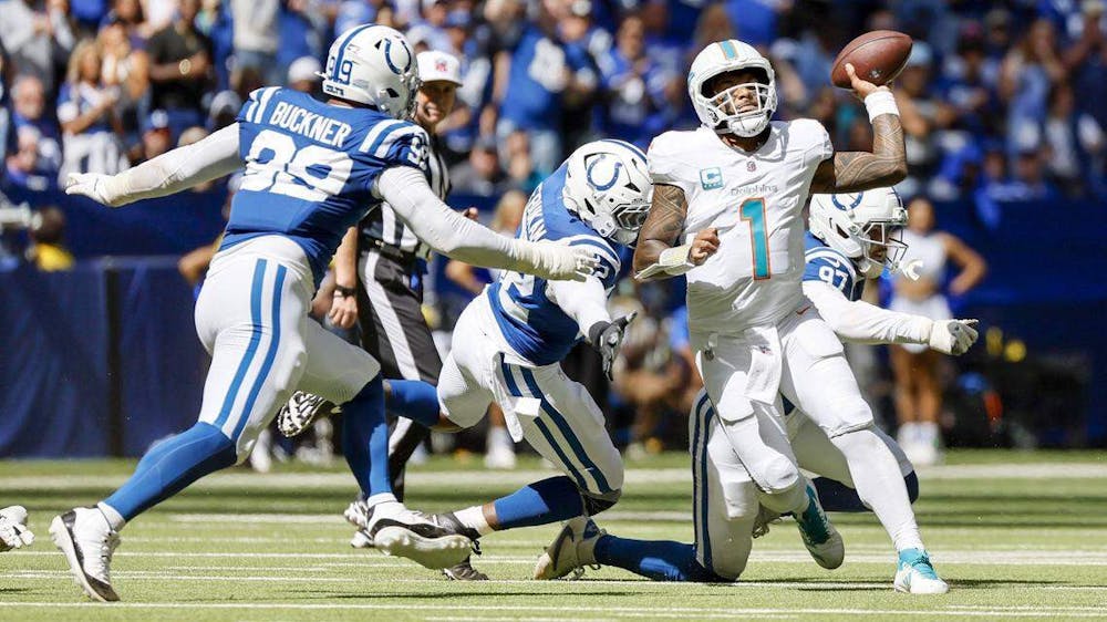 Miami Dolphins quarterback Tua Tagovailoa (1) under pressure by Indianapolis Colts defensive end Laiatu Latu (97), defensive end Samson Ebukam (52) and defensive tackle DeForest Buckner (99) during the second half of an NFL game at Lucas Oil Stadium in Indianapolis on Sunday, September 7, 2025, in Indianapolis. (PHOTO BY AL DIAZ/Tribune Content Agency)