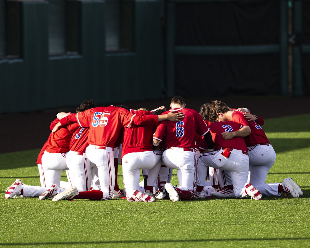Indiana players huddle before Indiana's loss to Indiana State at Bart Kaufman Field on March 24, 2026. (HN photo/Brady Owen)
