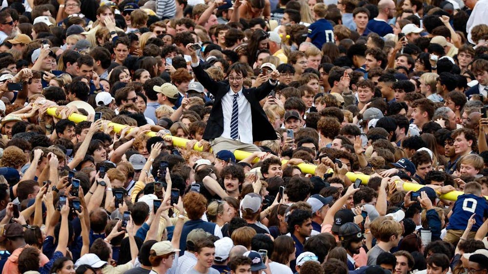 Georgia Tech football fans rip down the goal post and celebrate on the field after defeating the Miami Hurricanes during an NCAA game at Bobby Dodd Stadium at Hyundai Field in Atlanta, Georgia on Saturday, November 9, 2024. (Al Diaz/Tribune Content Agency)