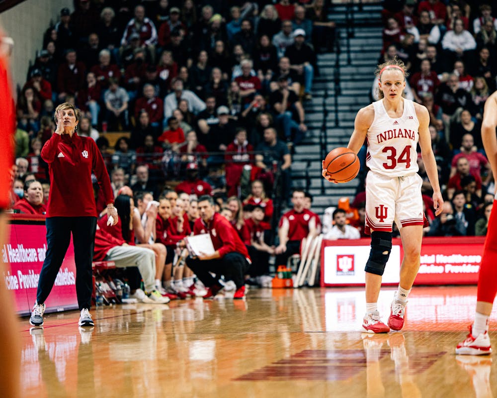 Grace Berger brings the ball up during Indiana's win over Ohio State on Jan. 26 as head coach Teri Moren watches. (HN photo/Cam Schultz)