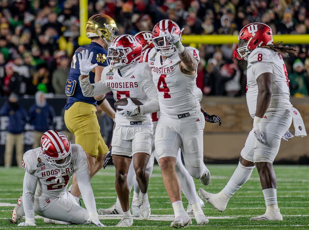 Linebacker Aiden Fisher (4) and defensive back D'Angelo Ponds (5) celebrate Ponds' interception in Indiana football's loss to Notre Dame in the College Football Playoffs at Notre Dame Stadium on December 20th, 2024. (HN Photo, Danielle Stockwell)