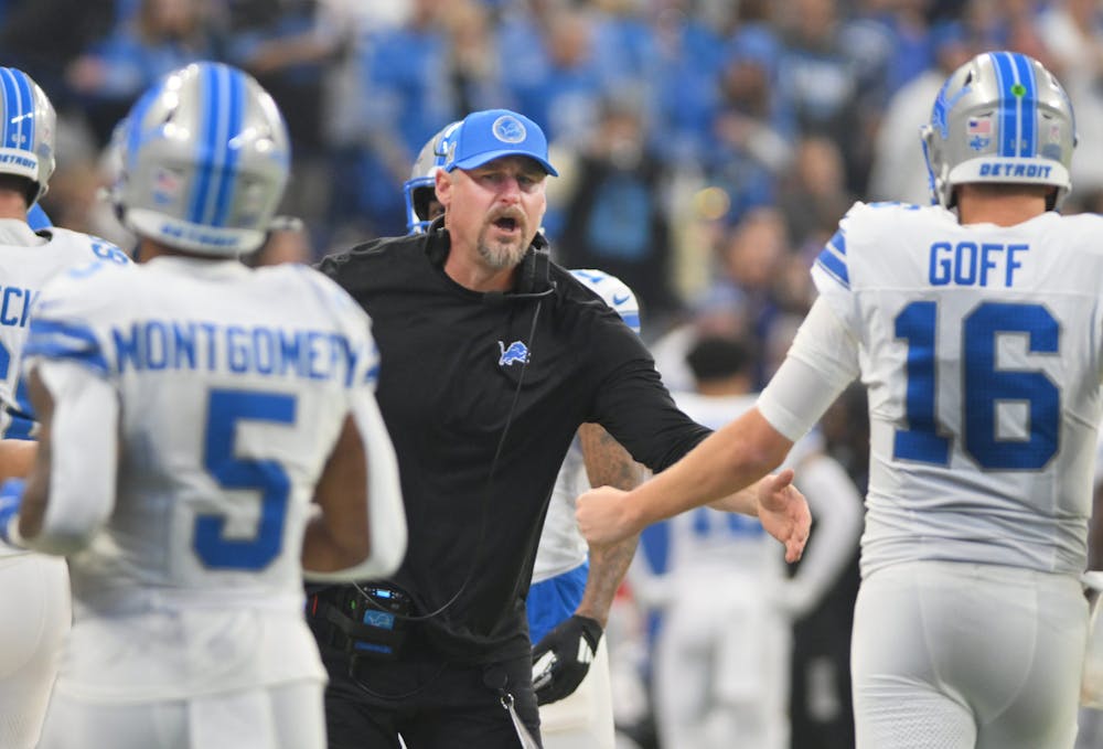 Detroit Lions head coach Dan Campbell welcomes the offense back to the sidelines after a score in the second quarter against the Indianapolis Colts at Lucas Oil Stadium in Indianapolis, Indiana on November 24, 2024. (Daniel Mears, The Detroit News, Tribune Content Agency)