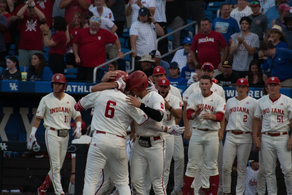 Peter Serruto celebrates at home plate with his teammates during Indiana's matchup with Kentucky on Saturday night. (Photo via Olivia Bianco)