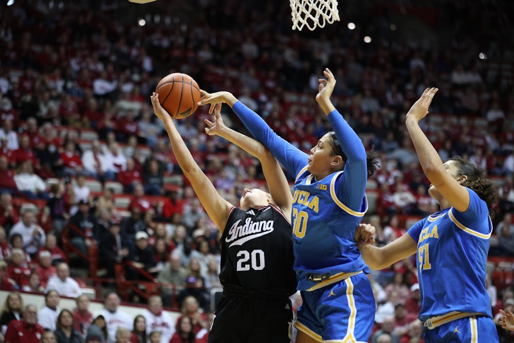 UCLA's Timea Gardiner (30) blocks Julianna LaMendola's shot during Indiana's loss to No. 1 UCLA on Jan. 4, 2025. (HN photo/Jaren Himelick)