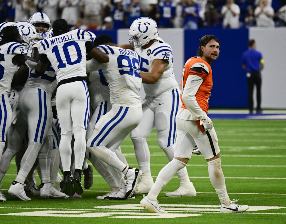 Denver Broncos cornerback Riley Moss (21) walks past the Indianapolis Colts football team after losing 29-28 at Lucas Oil Stadium in Indianapolis, Indiana, on Sunday, Sept. 14, 2025. (Photo by Andy Cross/The Denver Post/Tribune Content Agency)