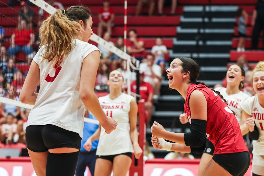 Libero Ramsey Gary (right) celebrates with Candela Alonso-Corcelles during the Cream and Crimson scrimmage on Aug. 19, 2023 at Wilkinson Hall in Bloomington, IN. (Photo By Pearson Georges/Indiana Athletics)