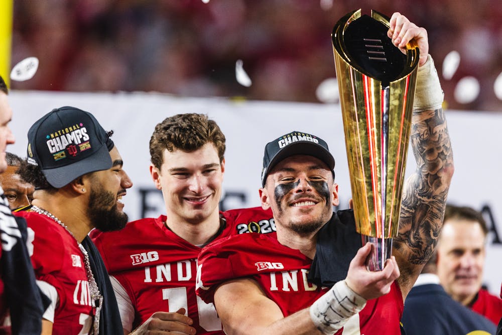 Aiden Fisher lifts the National Championship trophy after Indiana's win over Miami in the College Football Playoff National Championship Game on Jan. 19, 2026. (HN photo/Kallan Graybill)