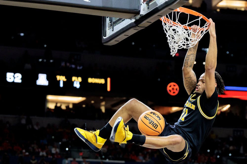 Michigan Wolverines guard Roddy Gayle Jr. (11) dunks as Michigan faces Arizona in the Final Four at Lucas Oil Stadium in Indianapolis on Friday, April 3 2026. (Jacob Hamilton/Tribune Content Agency)