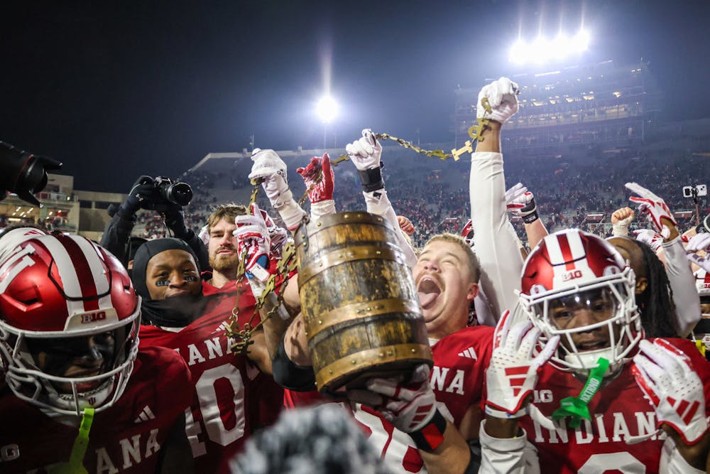 <p>Hoosier players celebrate with the Old Oaken Bucket after Indiana&#x27;s win over Purdue on Nov. 30, 2024. (HN photo/Jaren Himelick)﻿</p>