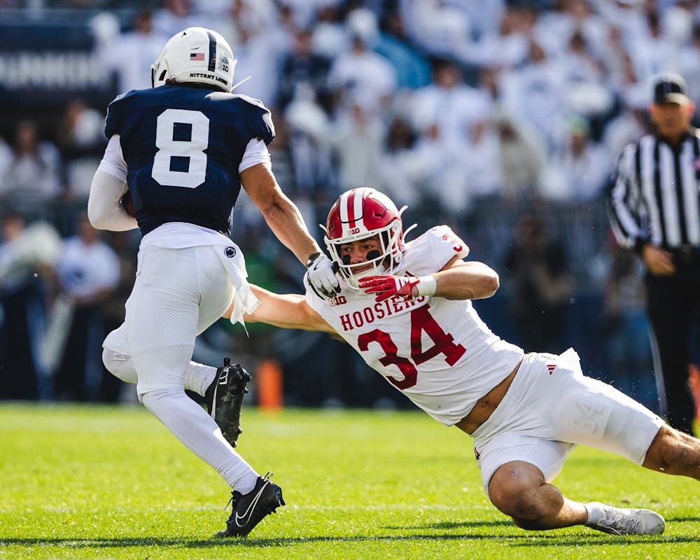 Jeff Utzinger dives to stop Penn State's Trebor Peña during Indiana's win over Penn State on Nov. 8, 2025. (HN photo/Kallan Graybill)