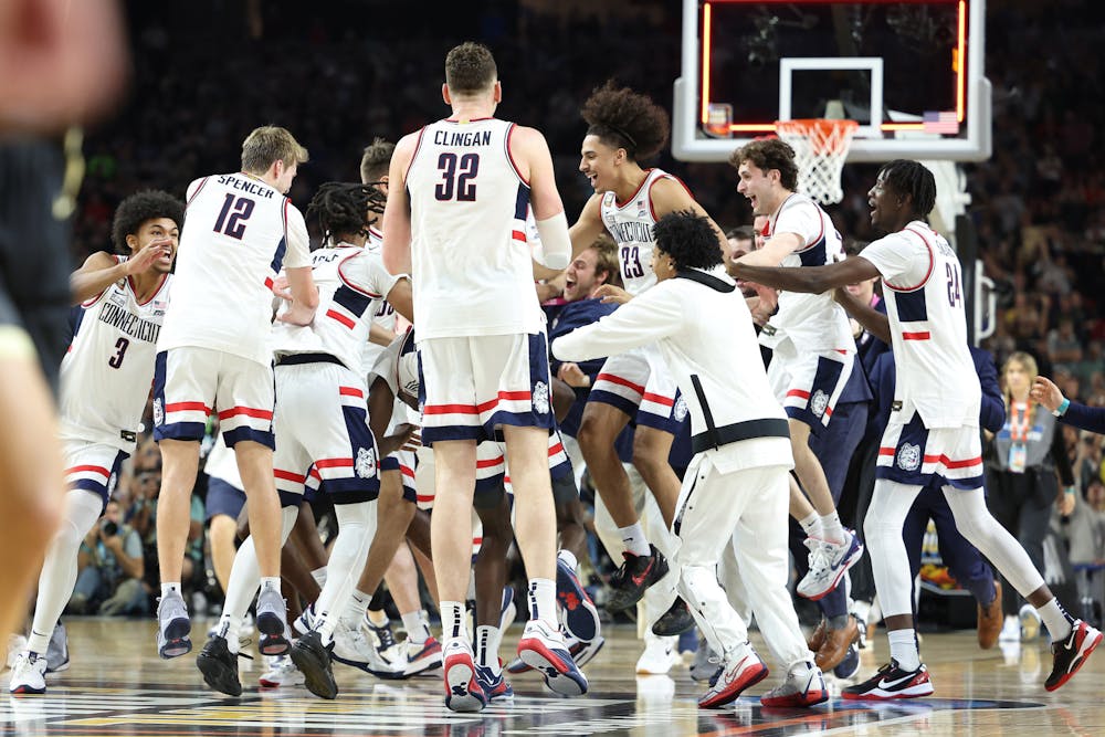 The Connecticut Huskies celebrate after beating the Purdue Boilermakers 75-60 to win the NCAA Men's Basketball Tournament National Championship game at State Farm Stadium on Monday, April 8, 2024, in Glendale, Arizona. (Jamie Squire/Getty Images/TNS)