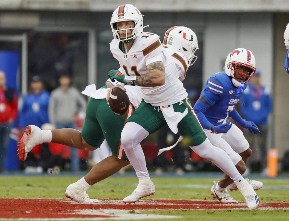 Miami Hurricanes quarterback Carson Beck (11) scrambles out of the pocket during an NCAA football game against the Southern Methodist University Mustangs in the first half at Gerald Ford Stadium on Saturday, November 1, 2025, in Dallas, Texas. (PHOTO BY AL DIAZ/Tribune Content Agency)