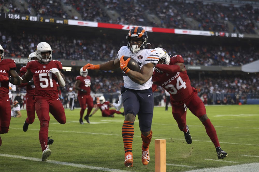 Bears running back Khalil Herbert (24) runs into the endzone for a first quarter touchdown during a game between the Bears and Arizona Cardinals at Soldier Field on Christmas Eve, Sunday, Dec. 24, 2023. (Trent Sprague/Chicago Tribune)