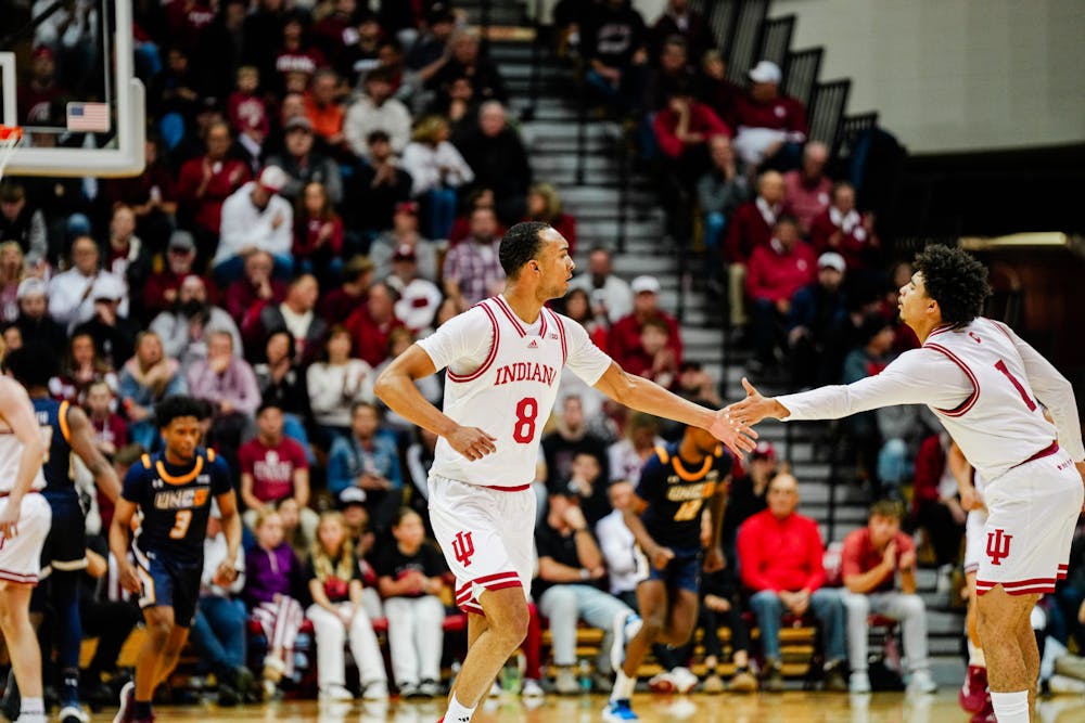 Bryson Tucker (center) gets a high-five during Indiana's win over UNC Greensboro on Nov. 21, 2024. (HN photo/Shrithik Karthik)