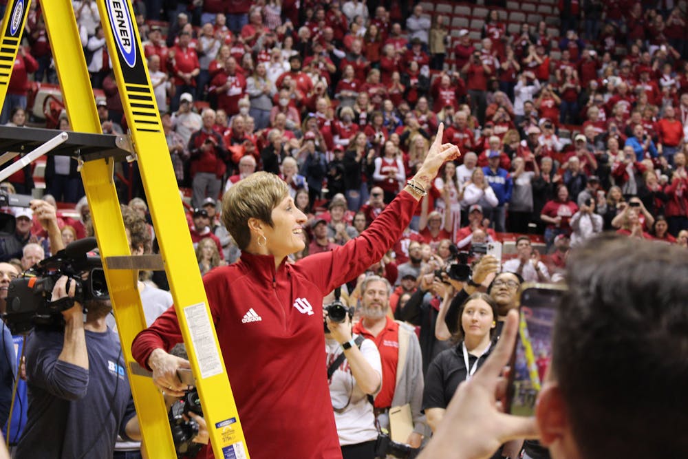 Indiana head coach Teri Moren prepares to cut down the nets after Indiana's win over Purdue on Feb. 19 to clinch the Big Ten regular-season title. (HN photo/Jaren Himelick)