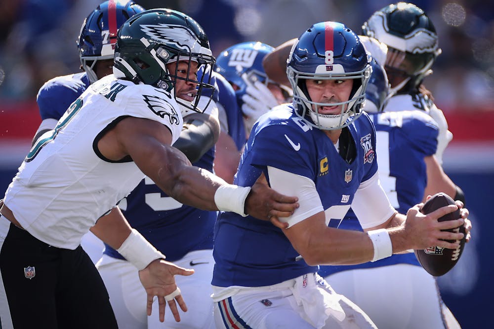 Daniel Jones is sacked by Nolan Smith of the Eagles on Oct. 20, 2024. The Giants released Jones in November. (David Maialetti/Tribune Content Agency)