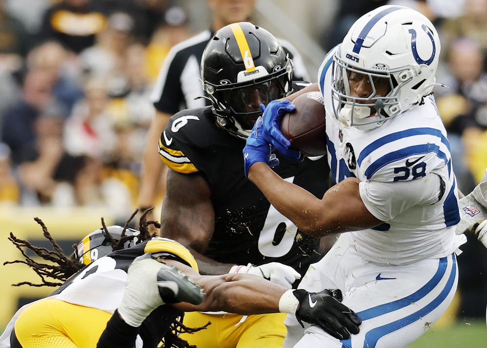 Jonathan Taylor (28) of the Indianapolis Colts is tackled by Kyle Dugger (29) and Patrick Queen (6) of the Pittsburgh Steelers during the second quarter in the game at Acrisure Stadium on Sunday, Nov. 2, 2025, in Pittsburgh. (Justin K. Aller/Getty Images/TNS)