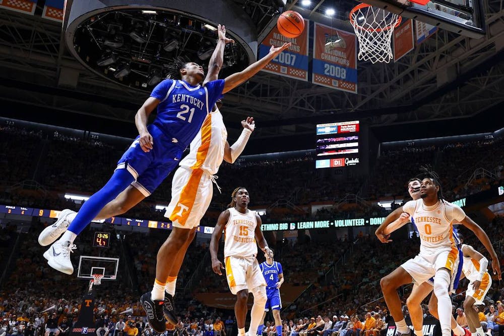 Kentucky guard D.J. Wagner (21) shoots the ball against Tennessee during Saturday night's Wildcats victory at Thompson-Boling Arena in Knoxville. (Tribune Content Agency/Silas Walker)