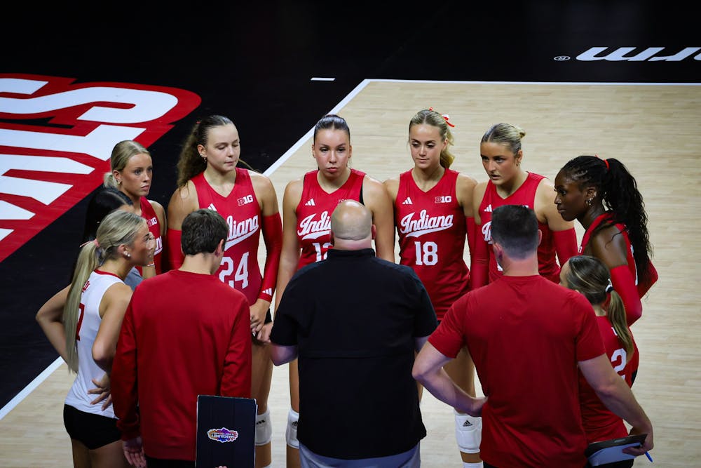 Indiana players listen to head coach Steve Aird during Indiana's loss to Louisville on Aug. 28, 2026. (HN photo/Andrea Campbell)
