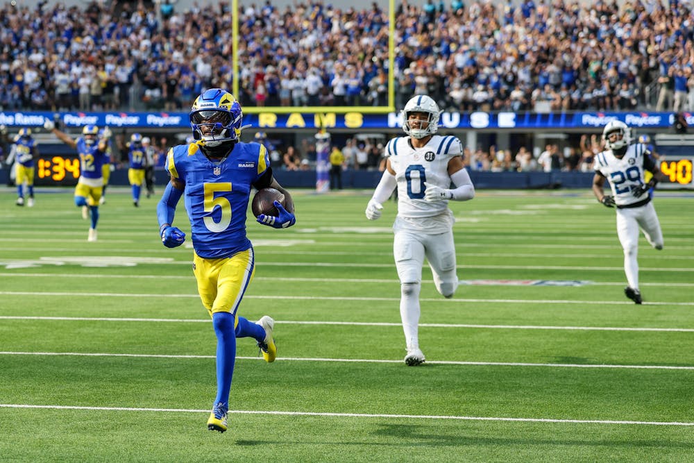 Los Angeles Rams wide receiver Tutu Atwell (5) trots into the end zone ahead of Indianapolis Colts defensive back Camryn Bynum on an 88-yard game-winning pass play at SoFi Stadium on Sunday, Sept. 28. 2025, in Inglewood, California. (Robert Gauthier/Los Angeles Times/TNS)