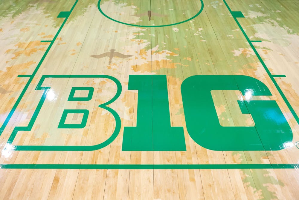 The Big Ten logo in the paint on the court at Matthew Knight Arena in Eugene. (Sean Meagher/Tribune Content Agency)