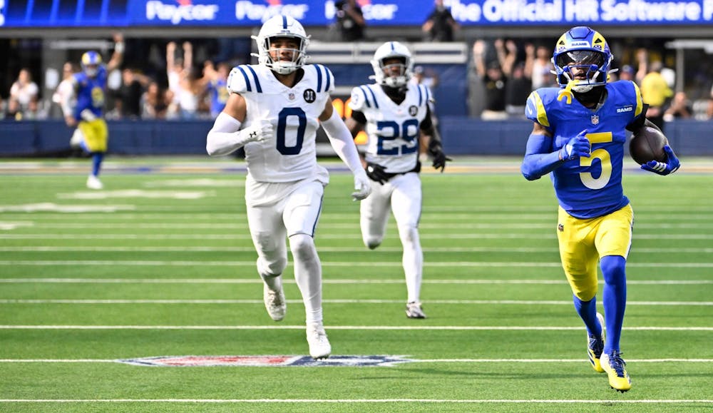 Wide receiver Tutu Atwell #5 of the Rams catches a pass and runs for a touchdown past Camryn Bynum #0 and teammate cornerback Mekhi Blackmon #29 of the Indianapolis Colts late in the fourth quarter of a NFL football game at SoFi Stadium in Inglewood on Sunday, Sept. 28, 2025. (Photo by Keith Birmingham, Pasadena Star-News/SCNG/Tribune Content Agency)