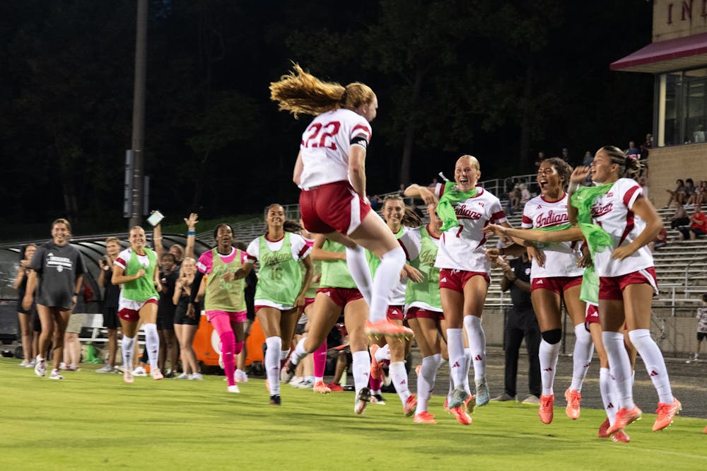 Piper Coffield leaps in celebration with her teammates after scoring during Indiana's draw against Bellarmine on Aug. 21, 2026. (HN photo/Dapho Sproles)