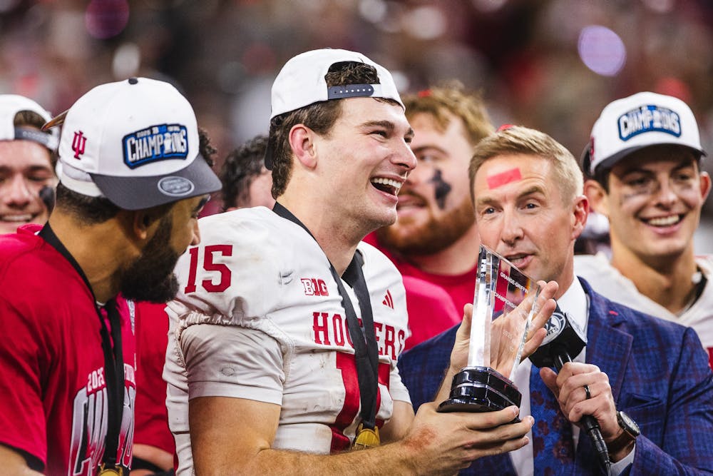 Fernando Mendoza accepts the Grange-Griffin Big Ten Championship Game MVP award after Indiana's win in the Big Ten championship game over Ohio State on Dec. 6, 2025 in Lucas Oil Stadium in Indianapolis. (HN photo/Kallan Graybill)