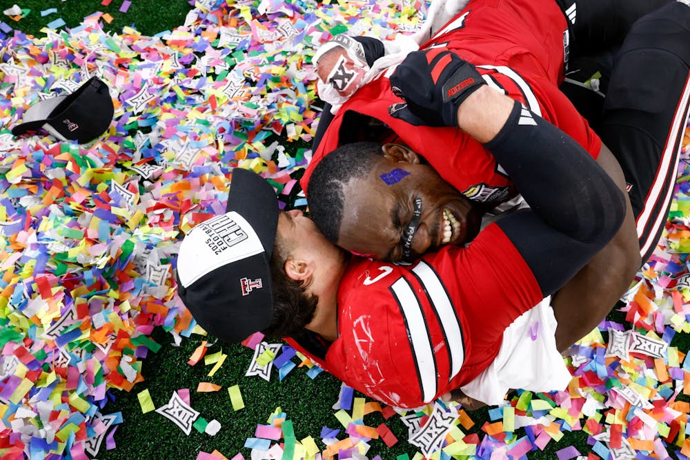Texas Tech linebacker Jacob Rodriguez (10) hugs linebacker Bryce Ramirez (3) after winning the Big 12 Championship football game at AT&T Stadium, Saturday, Dec. 6, 2025, in Arlington. Texas Tech defeated BYU 34-7. (Elías Valverde II/Tribune Content Agency)