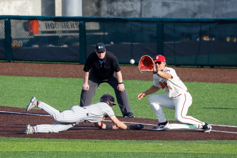 Jake Hanley reaches for a pick-off throw during Indiana's win over Minnesota on March 20, 2026. (HN photo/Dapho Sproles)