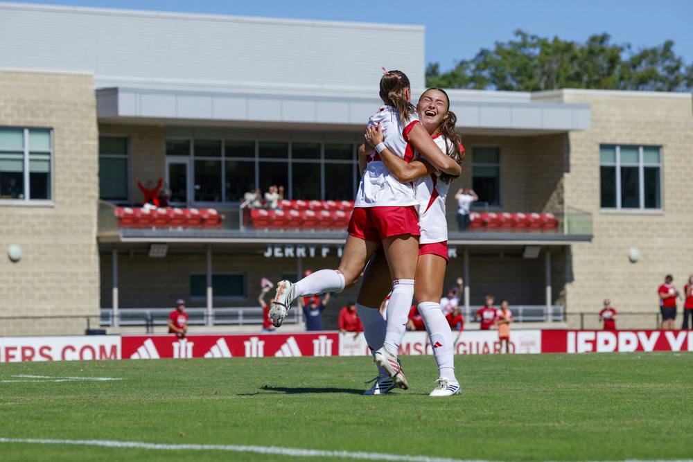 Jenna Chatterton (left) and Kennedy Neighbors celebrate during Indiana's loss to Michigan on Oct. 4, 2026. (HN photo/Olivia Smith)