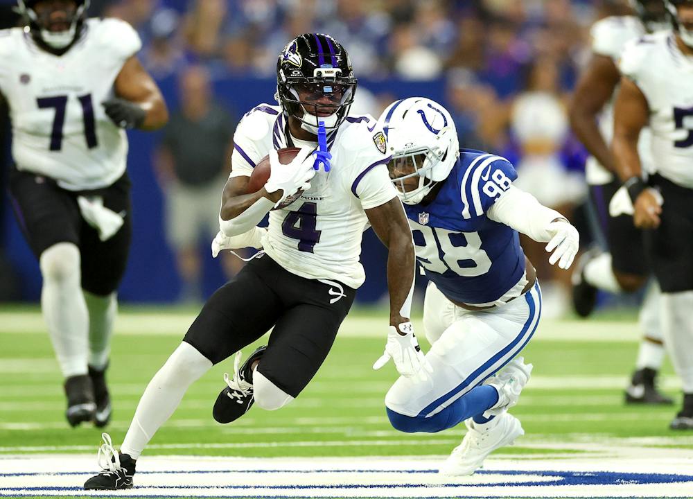 Zay Flowers (4) of the Baltimore Ravens is pursued by Arden Key (98) of the Indianapolis Colts during the second quarter of the game at Lucas Oil Stadium on Sunday, Sept. 13, 2026, in Indianapolis. (Andy Lyons/Getty Images/TNS)