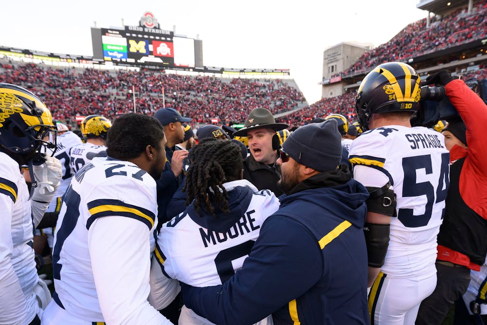 Michigan and Ohio State players get into a fight on the field after the game. (David Guralnick, Detroit News/Tribune Content Agency)