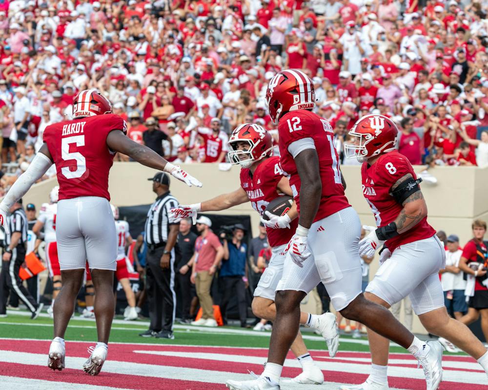 <p>Indiana&#x27;s defense celebrates after an Isaiah Jones interception in Indiana&#x27;s win over WKU. (HN Photo/Lindsey Soet)﻿</p>