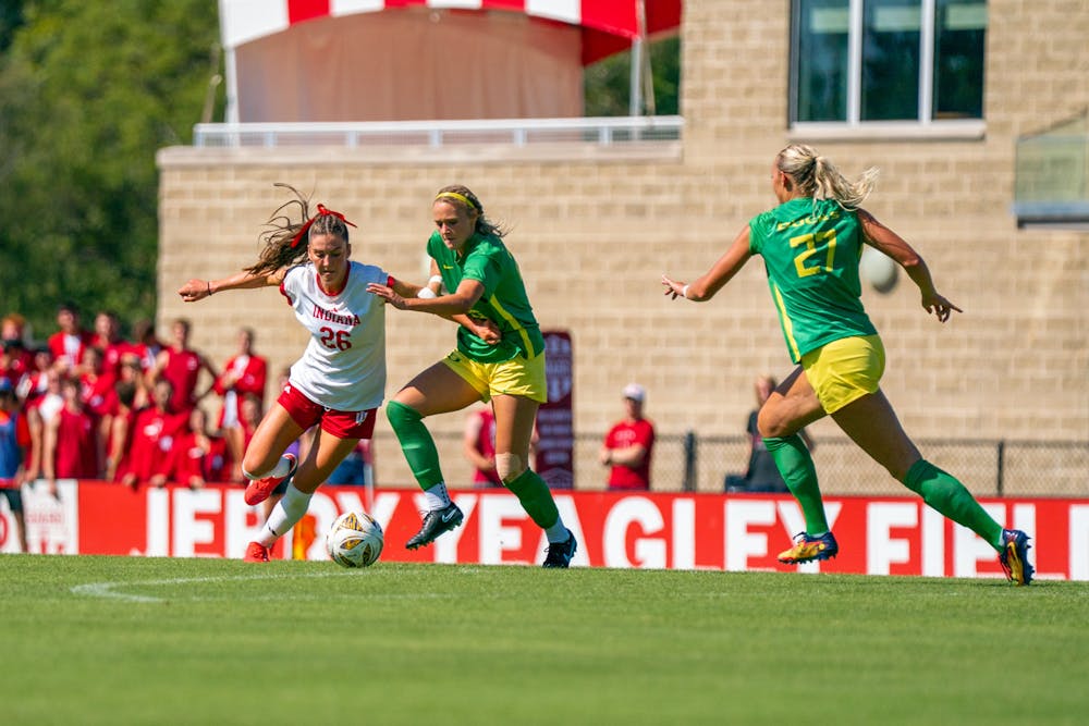<p>Indiana midfielder Maggie Ledwith dribbles around a pair of Oregon defenders in the Hoosiers&#x27; 3-3 draw against the Ducks on Sept. 28, 2025. (HN photo/JT Frenzel)</p>