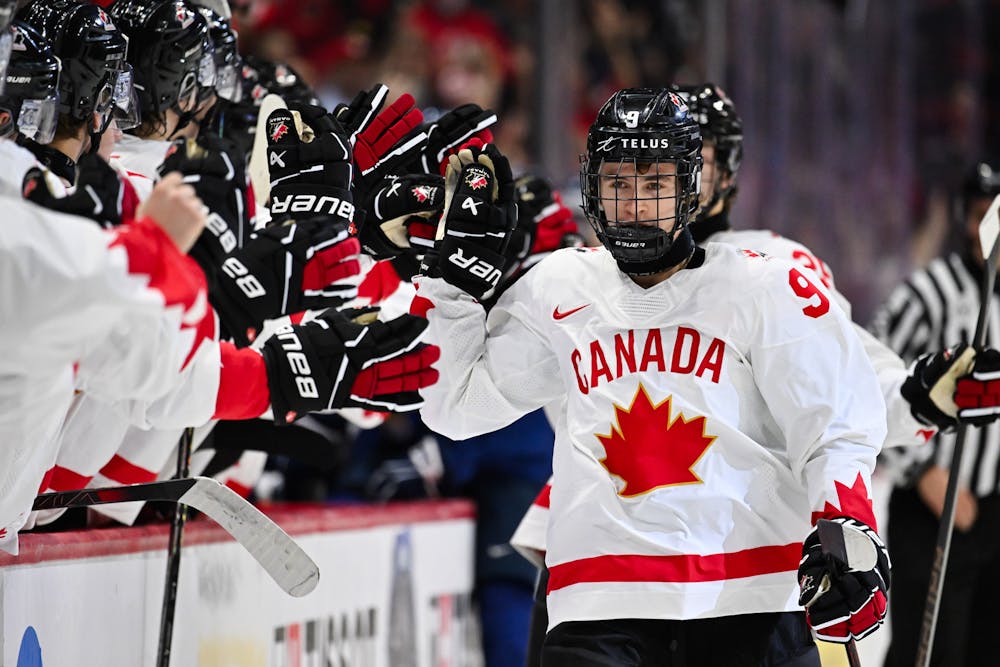 Team Canada's Gavin McKenna (9) celebrates his goal with teammates on the bench during the first period at the IIHF World Junior Championship against Team Finland at Canadian Tire Centre on Dec. 26, 2024, in Ottawa. (Minas Panagiotakis/Getty Images/TNS)
