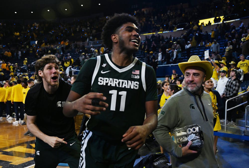 Michigan State basketball's Jase Richardson runs off the floor with a smile after the 75-62 victory over Michigan at the Crisler Center in Ann Arbor, Michigan on February 21, 2024. (Daniel Mears, The Detroit News, Tribune Content Agency)