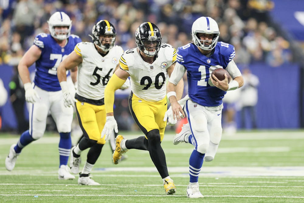 Indianapolis Colts quarterback Gardner Minshew (10) runs past the Pittsburgh Steelers linebacker T.J. Watt (90) during the second quarter at Lucas Oil Stadium on Saturday, Dec. 16, 2023, in Indianapolis. (Andy Lyons/Getty Images/TNS)