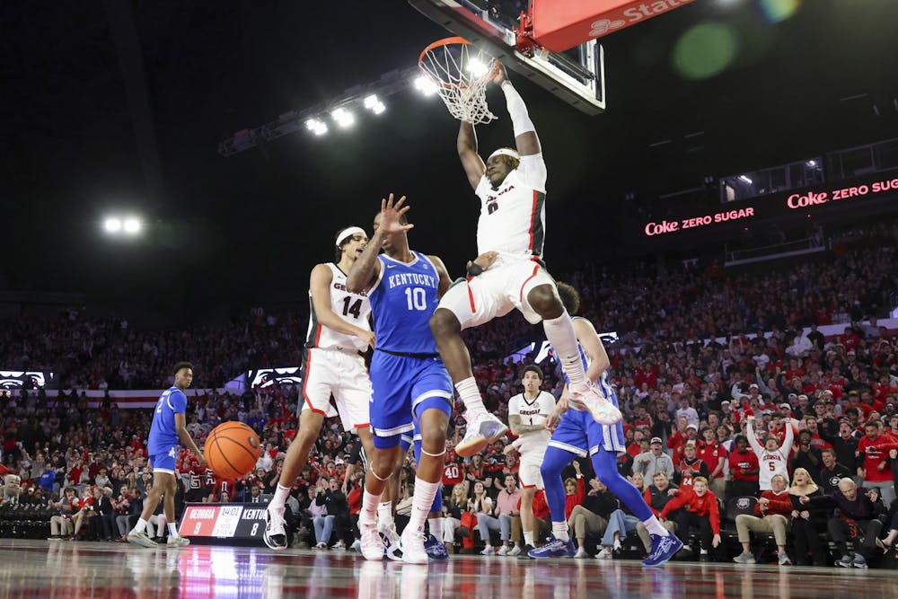 Georgia center Somto Cyril (6) dunks against Kentucky forward Brandon Garrison (10) during the first half in a NCAA men’s basketball game at Stegeman Coliseum, Tuesday, Jan. 7, 2025, in Athens, Ga. Georgia defeated Kentucky 82-69. (Jason Getz / AJC/Tribune Content Agency)