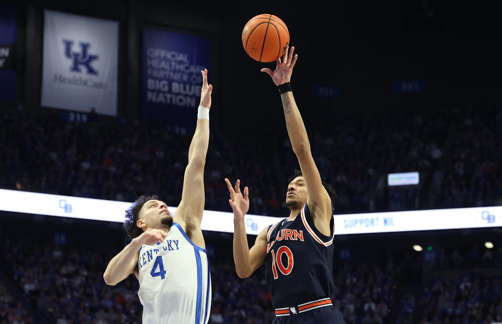 Auburn's Chad Baker-Mazara (10) puts up a shot under pressure from Kentucky's Koby Brea (4) at Rupp Arena on Saturday, March 1, 2025, in Lexington, Kentucky. (Andy Lyons/Getty Images/TNS)