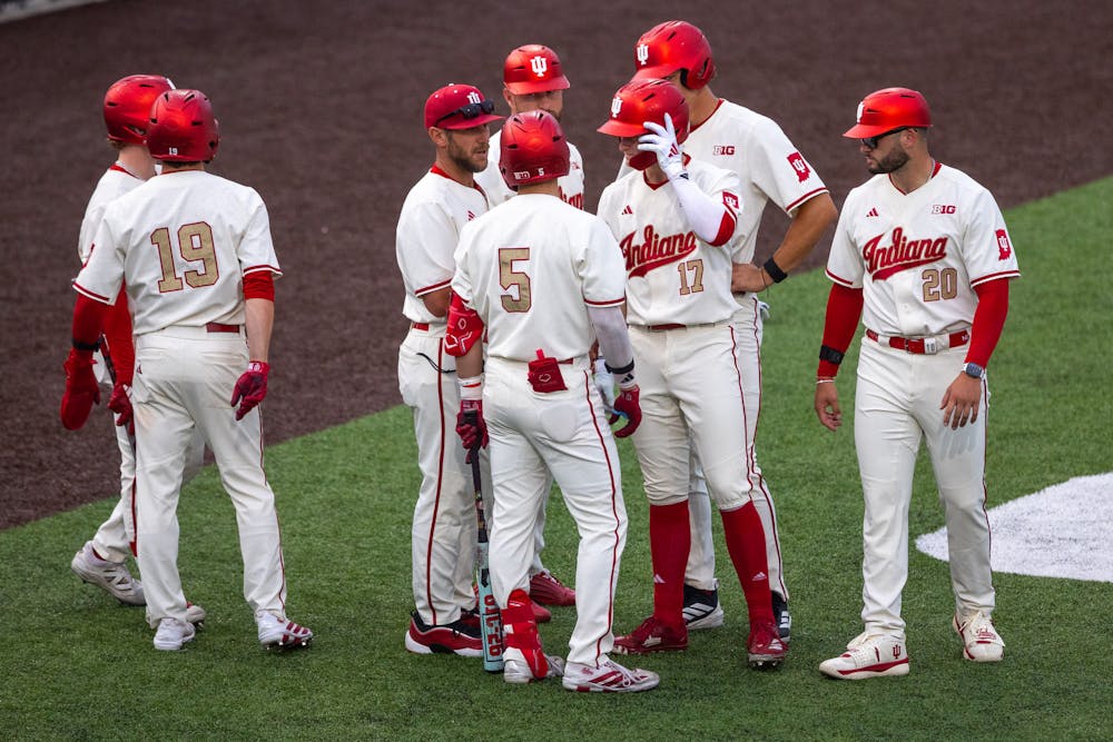 <p>Indiana head coach Jeff Mercer (third from left) speaks to his players during Indiana&#x27;s win over Abilene Christian on April 17, 2026. (HN photo/Lauren McKinney)</p>